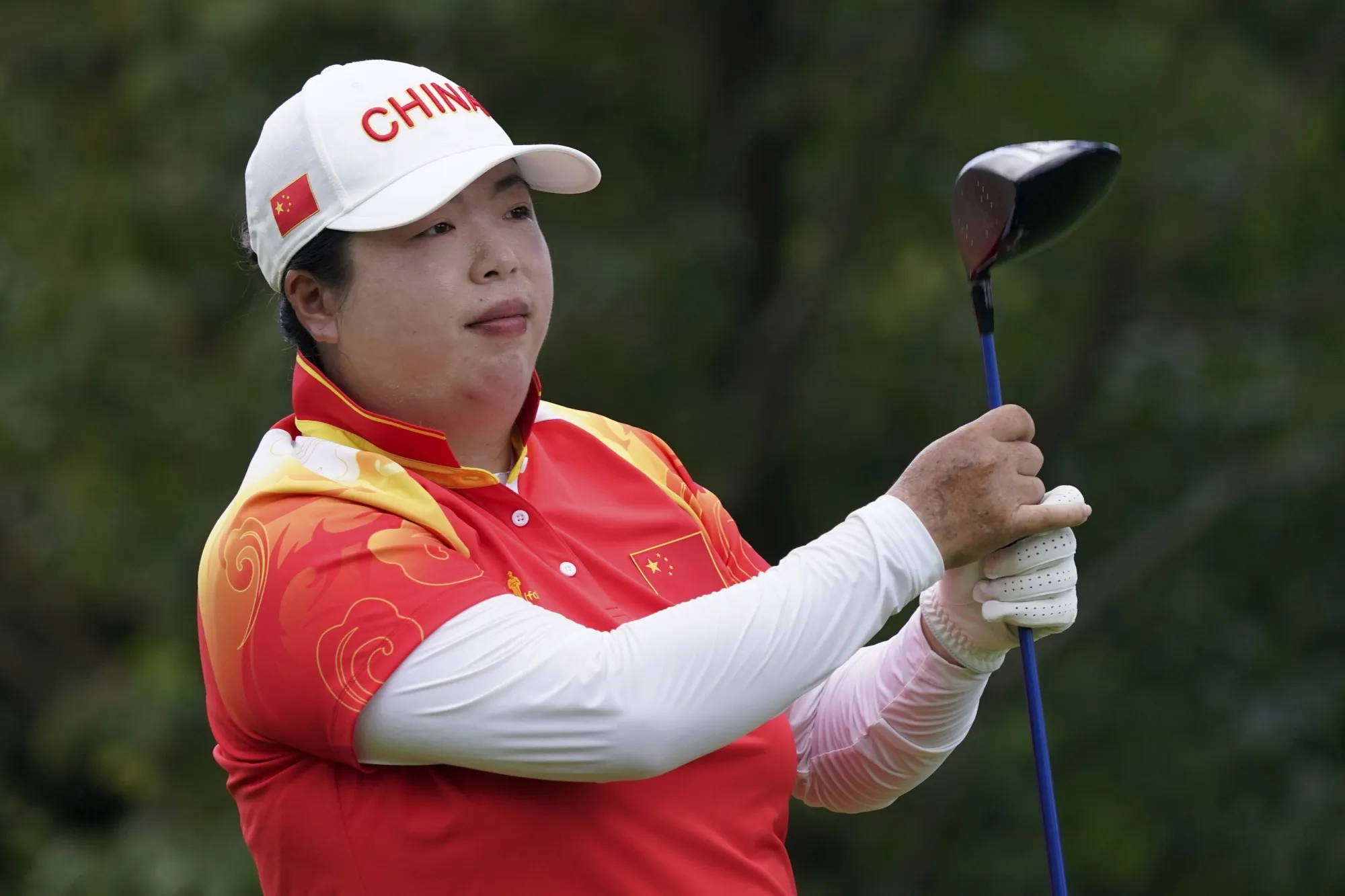 Shanshan Feng, of China, competes during the final round of the women's golf event at the 2020 Summer Olympics, on Aug. 7, 2021, at the Kasumigaseki Country Club in Kawagoe, Japan. Feng, the first Chinese player to win a major, has announced her retirement from the LPGA Tour. (AP Photo/Matt York, File)