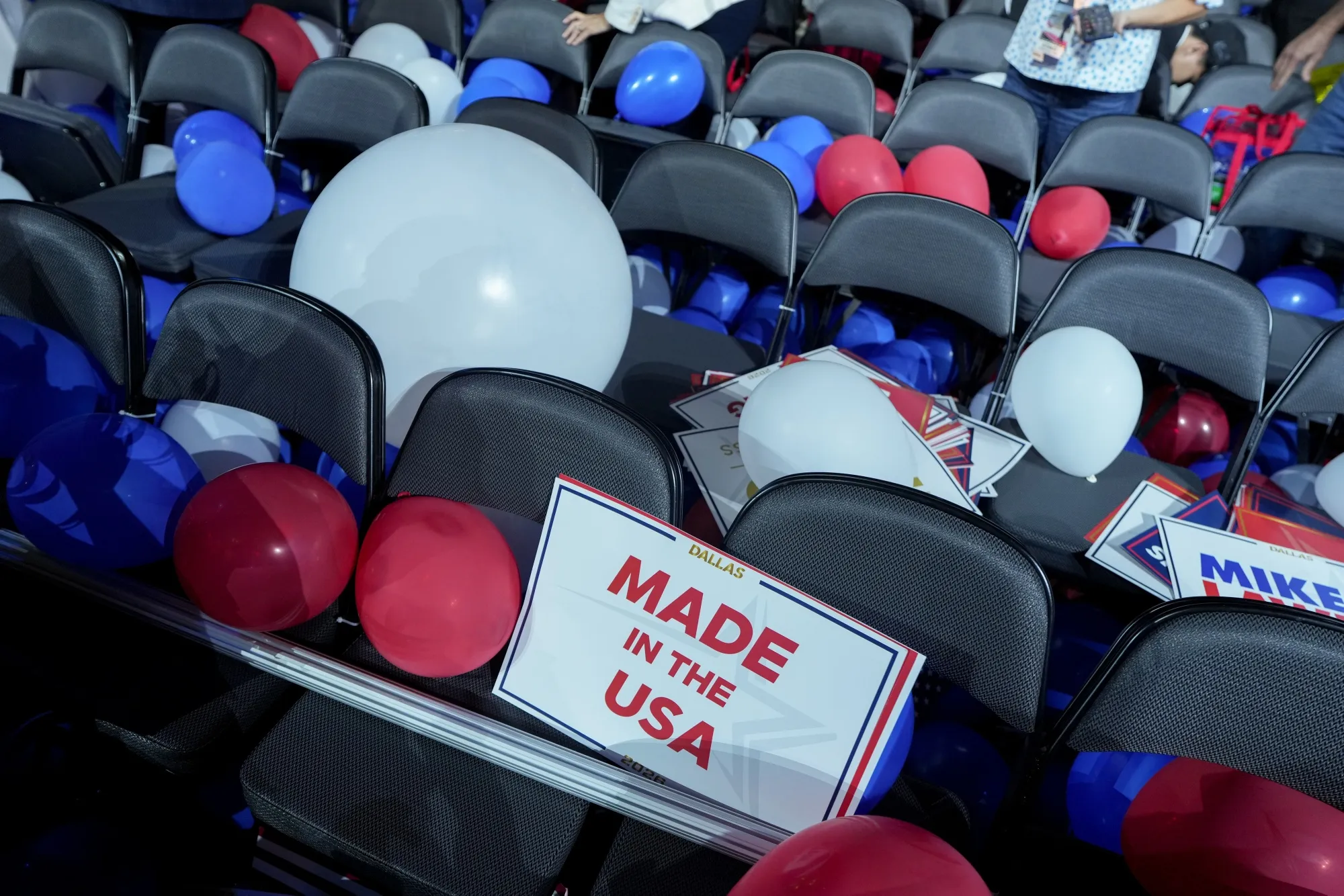 Balloons surround a "Made In The USA" sign during the Republican Midterm Convention at the American Airlines Center in Dallas on Sept. 10.