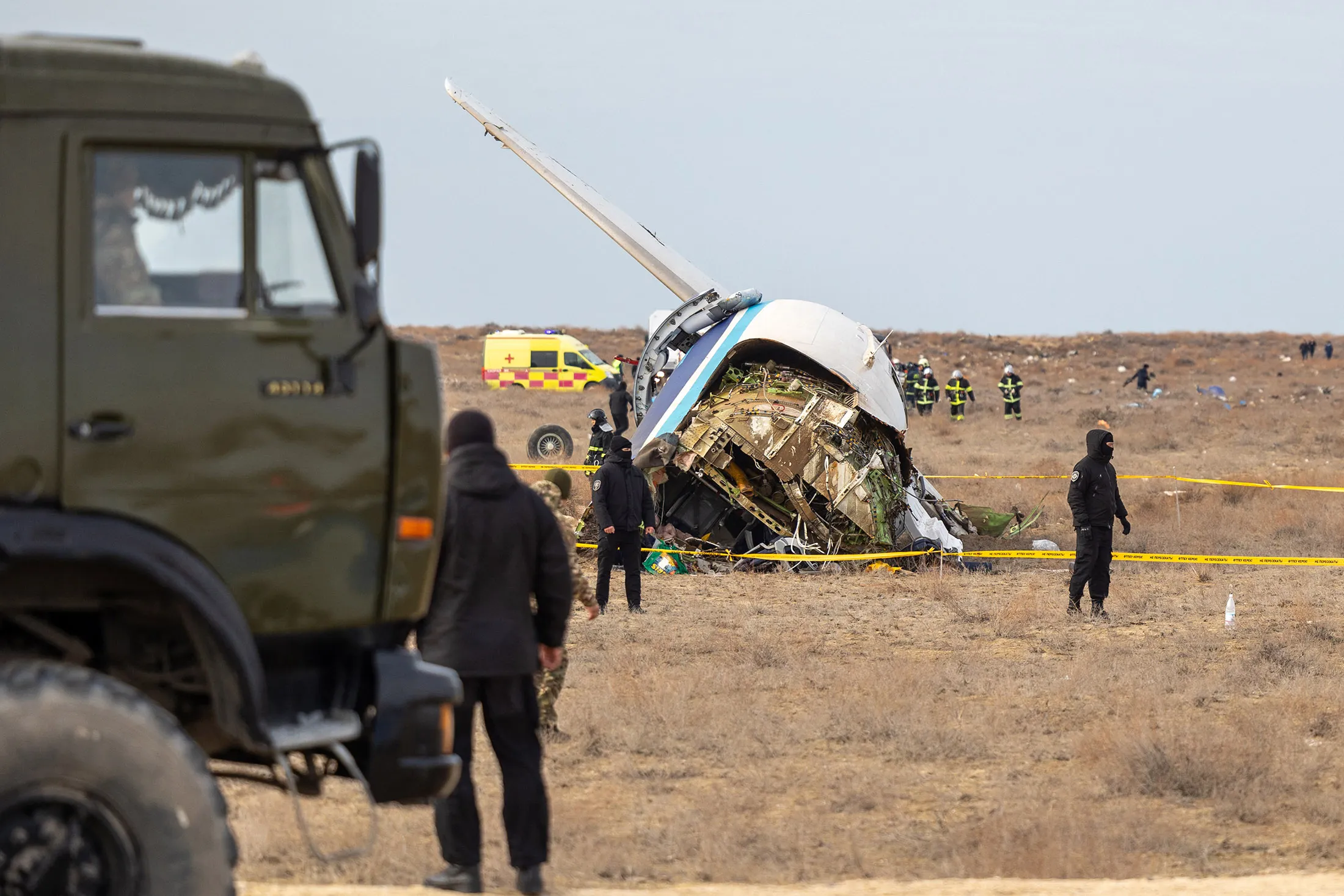 Emergency crews work at the crash site of an Azerbaijan Airlines passenger jet near the western Kazakh city of Aktau on Dec. 25.