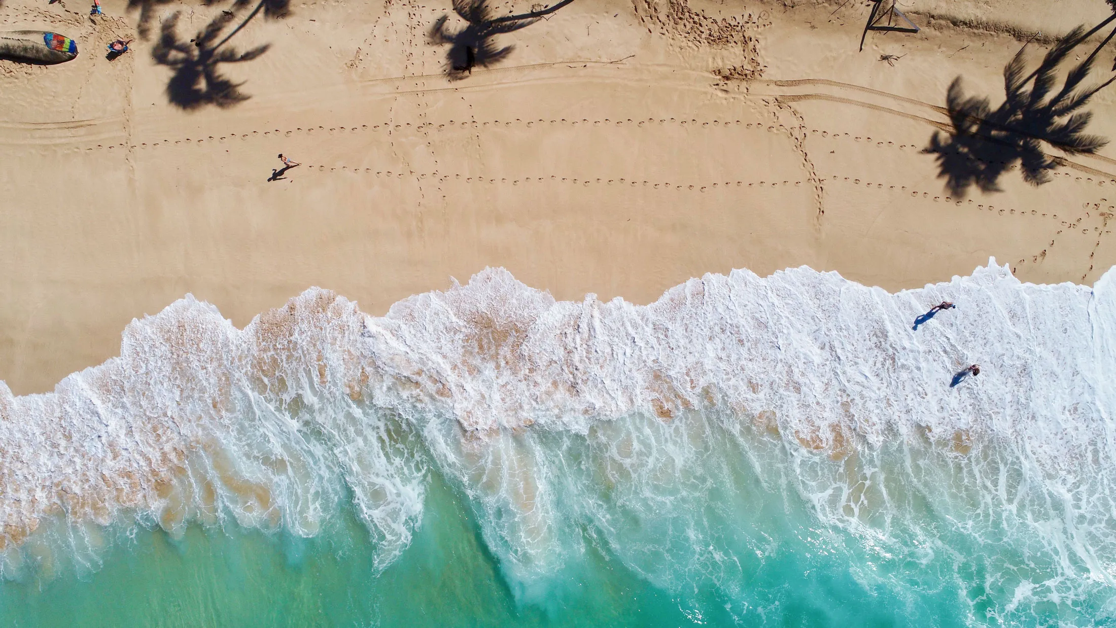 Waves crash at normally crowded Sunset Beach Park on the North Shore of Oahu, Hawaii.
