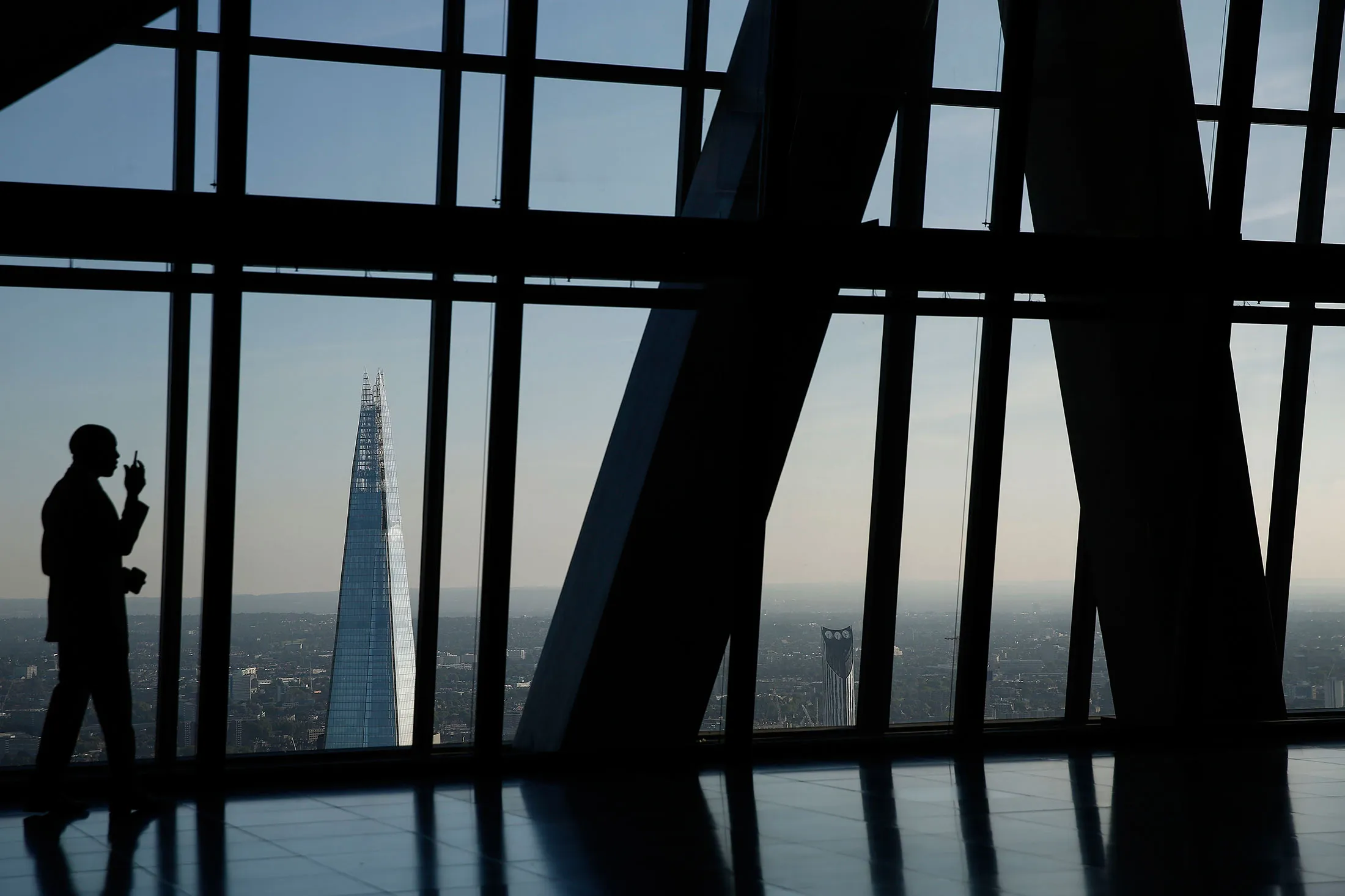 The Shard skyscraper stands on the city skyline seen from the 47th floor of the Leadenhall Building, also known as the Cheesegrater, in the financial district of London, U.K., on Sept. 3, 2014.

