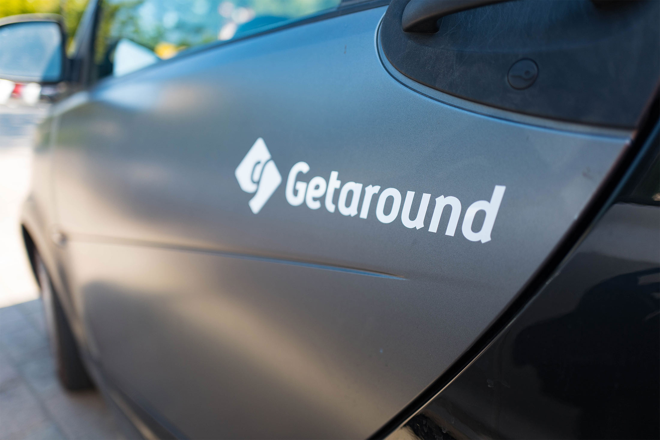 A logo for Getaround peer-to-peer car-sharing service is displayed on the side of a car in&nbsp;Mountain View, California.