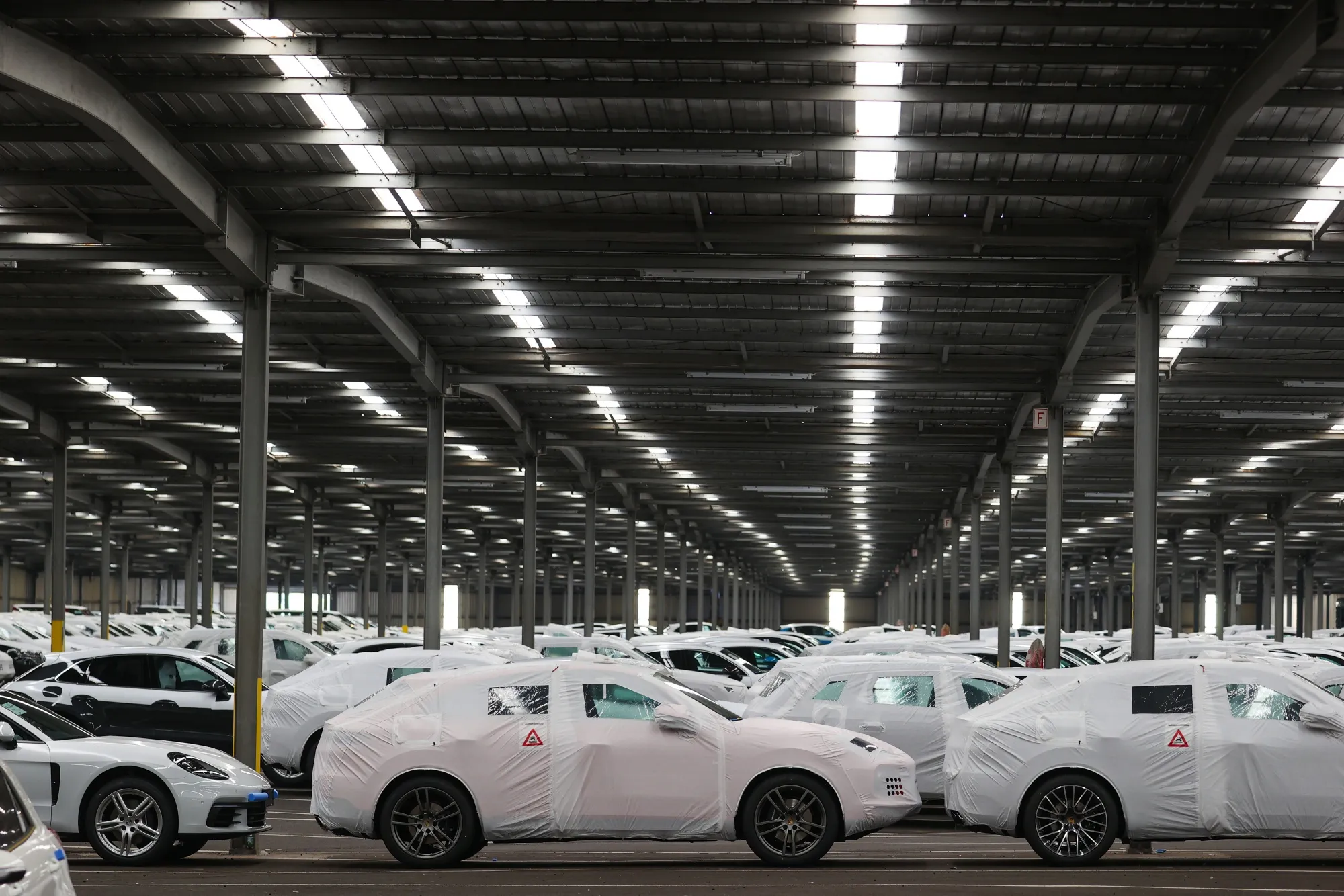 New automobiles await transportation at the Port of Bremerhaven, Germany, on Sept. 15.&nbsp;Europe’s new-car registrations have fallen by almost a third this year to 7.3 million.