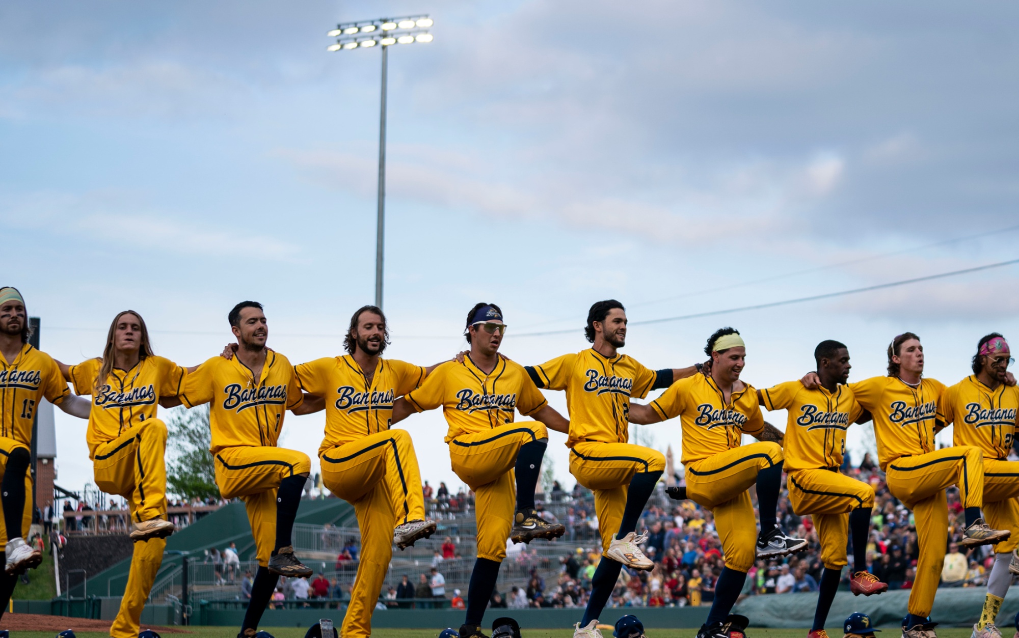 The Savannah Bananas dance at the start of a game in Kansas City, Kansas, in May.