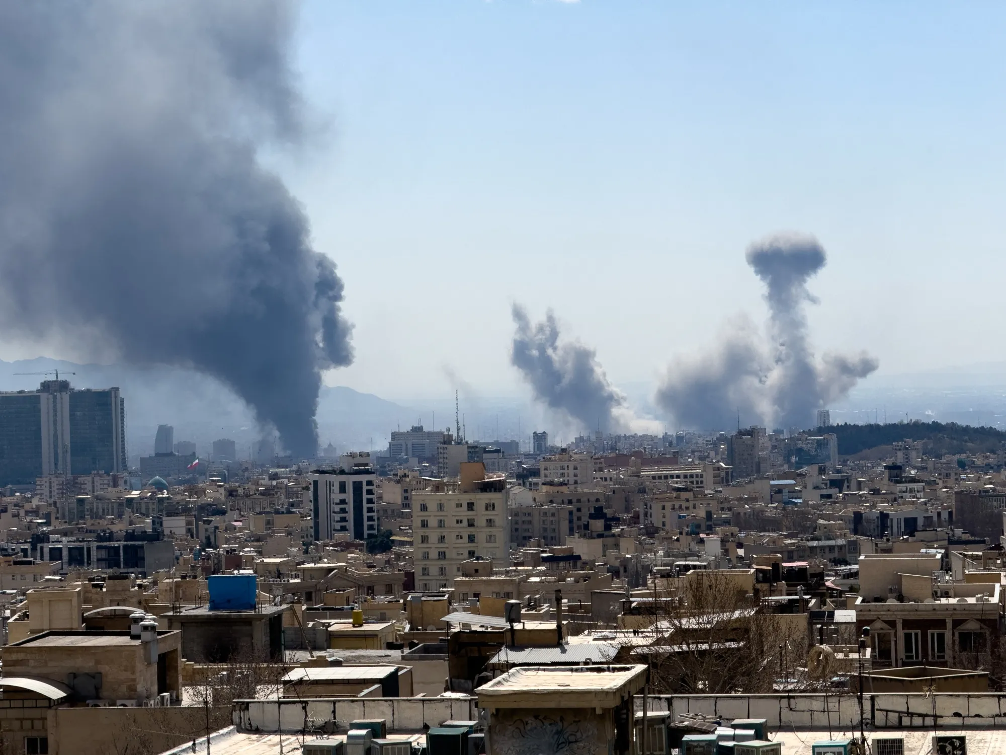 Plumes of smoke rise following reported explosions in Tehran on March 1, 2026, after Iran’s supreme leader, Ayatollah Ali Khamenei, was killed a day earlier.