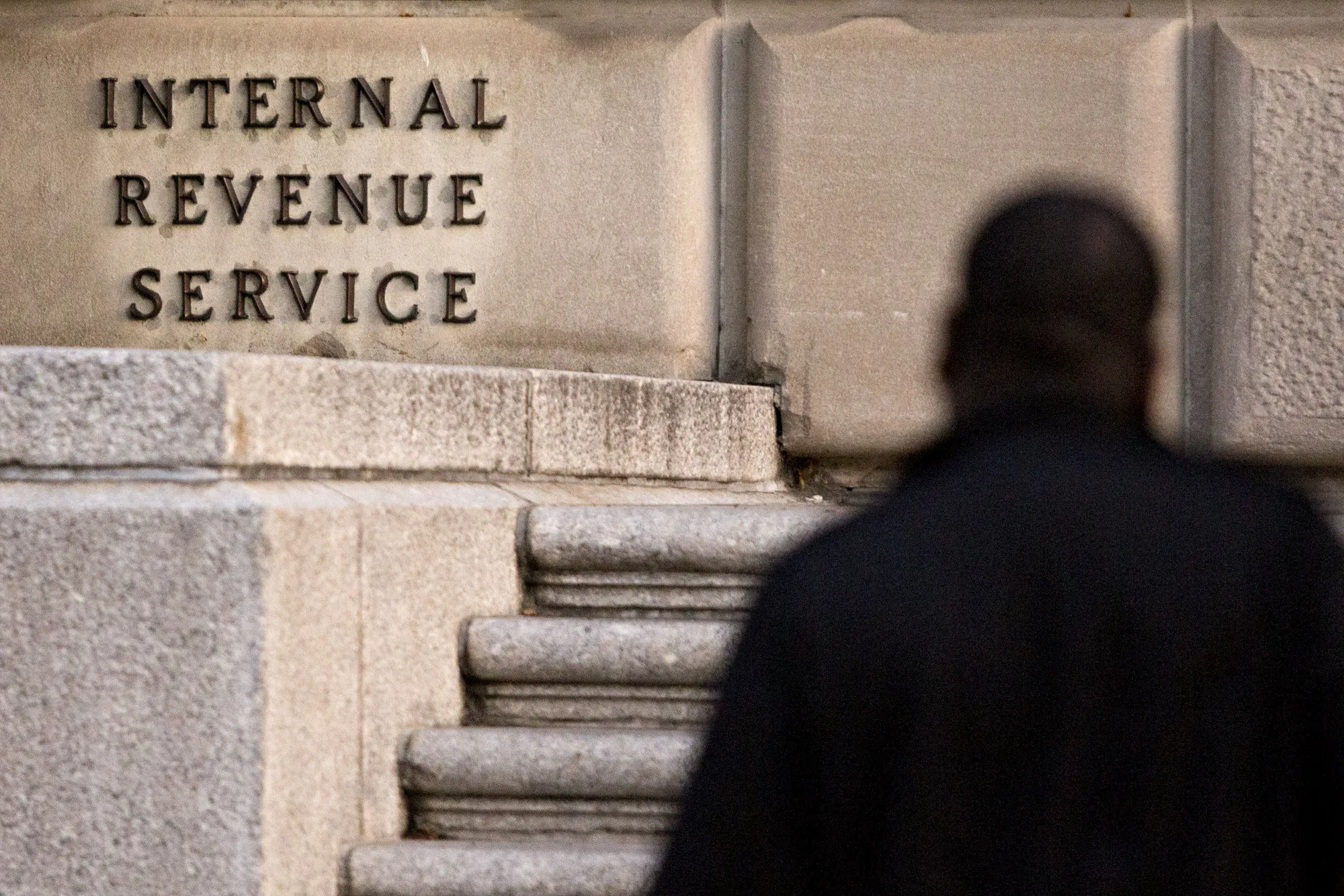 A man walks past the Internal Revenue Service&nbsp;headquarters in Washington, D.C.