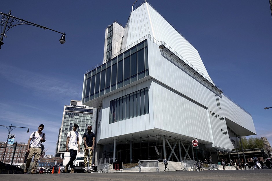 People walk past the new Whitney Museum of American Art in New York.