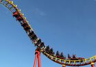 A man enjoys a ride on a roller coaster