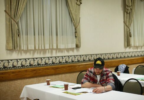 A farmer reads through the Annual Report at Ontario Ginseng Growers Association's 2016 AGM in Delhi, Ontario, about 150 km Southwest of Toronto.
