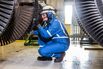 Gianpiero Di Marzo of Baker Hughes works on a gas turbine using a Smart Helmet, which allows a remote engineer to see what he’s looking at in real time, on March 16, 2018, in Houston.