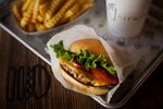 A burger, fries, and beverage at a Shake Shack restaurant in New York.