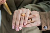 LGBTQs couple showing their couple rings at Sai Suddha
