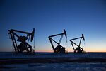 The silhouettes of pumpjacks are seen above oil wells in the Bakken Formation near Dickinson, North Dakota, U.S., on&nbsp;March 7, 2018.