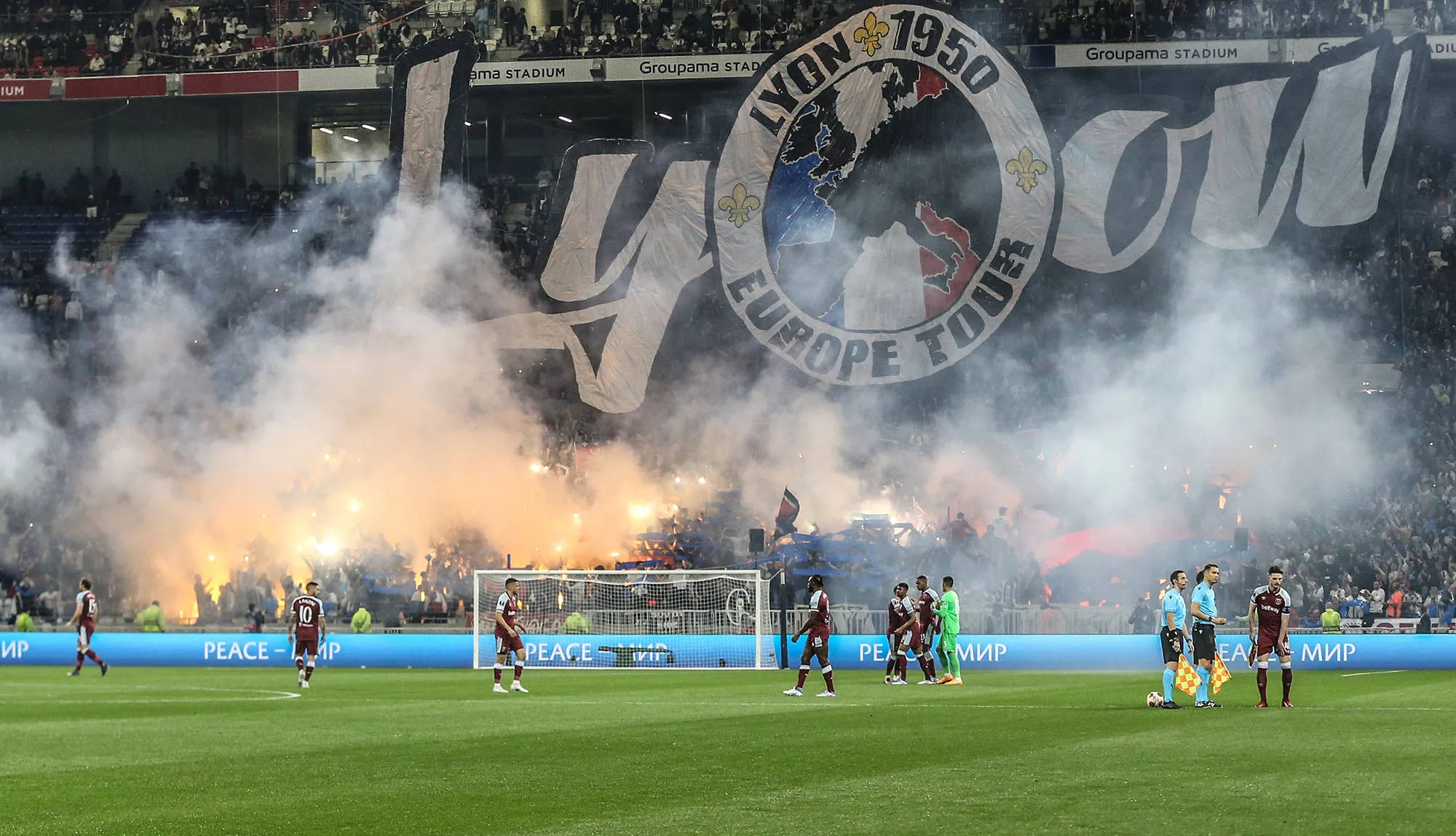 Flares light up behind the goal during the UEFA Europa League Quarter Final Leg Two match between Olympique Lyon and West Ham United&nbsp;in Lyon, France.&nbsp;