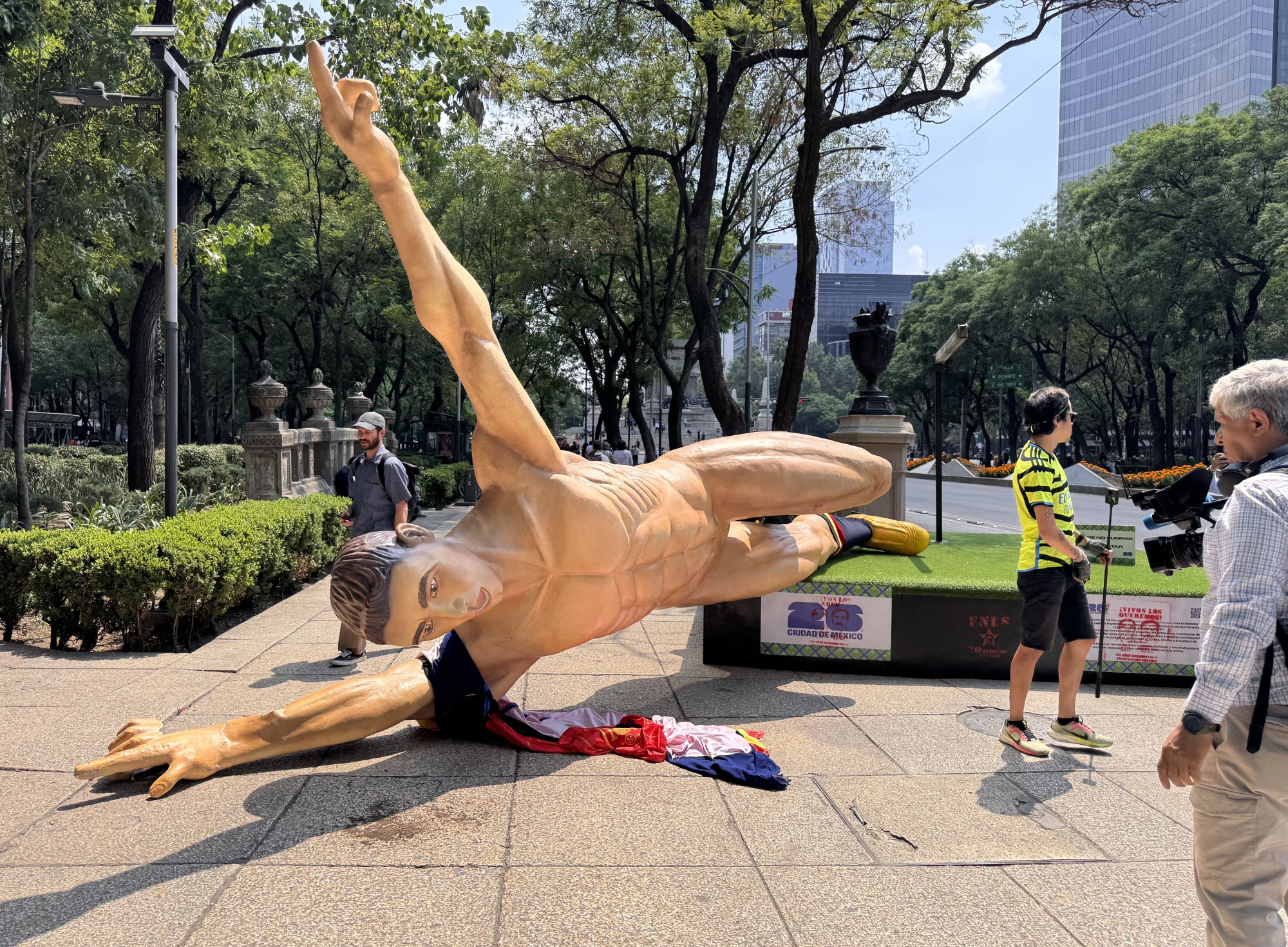 A statue depicting a World Cup player toppled in Mexico City.