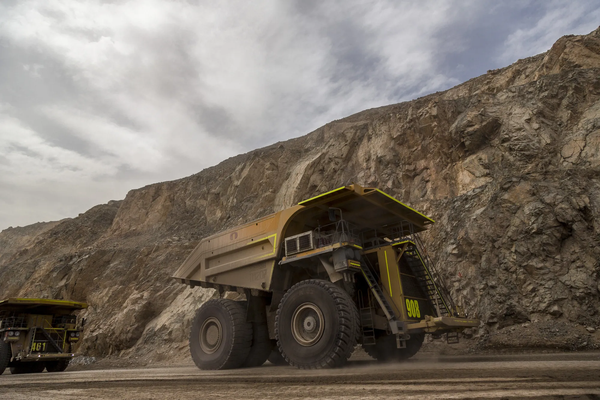 Trucks transport minerals inside an&nbsp;open pit copper mine near Calama, Chile.
