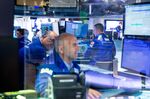 Traders work on the floor of the New York Stock Exchange (NYSE) in New York, U.S.