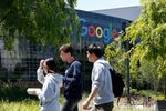 People walk in Google's main campus as a sit-in&nbsp;takes place within Google's main cafeteria in Mountain View, Calif. on May 1.