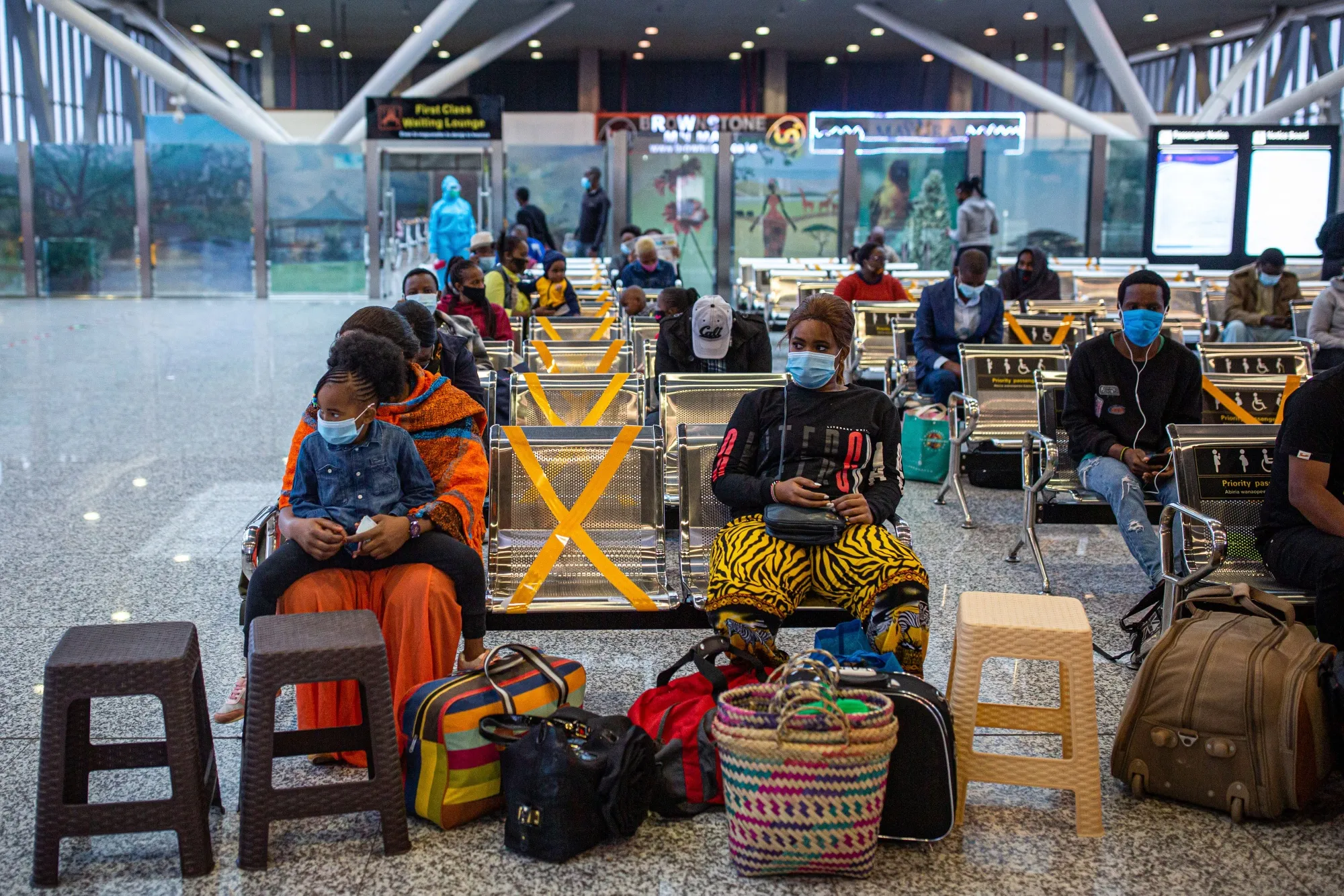 Barrier tape cordons off seating to assist social distancing in the passenger waiting area inside a railway terminal&nbsp;in Nairobi, on Aug. 18.