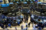 Traders work on the floor of the New York Stock Exchange in New York, U.S.
