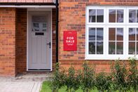 A 'For Sale' sign outside a home in Sittingbourne, UK.