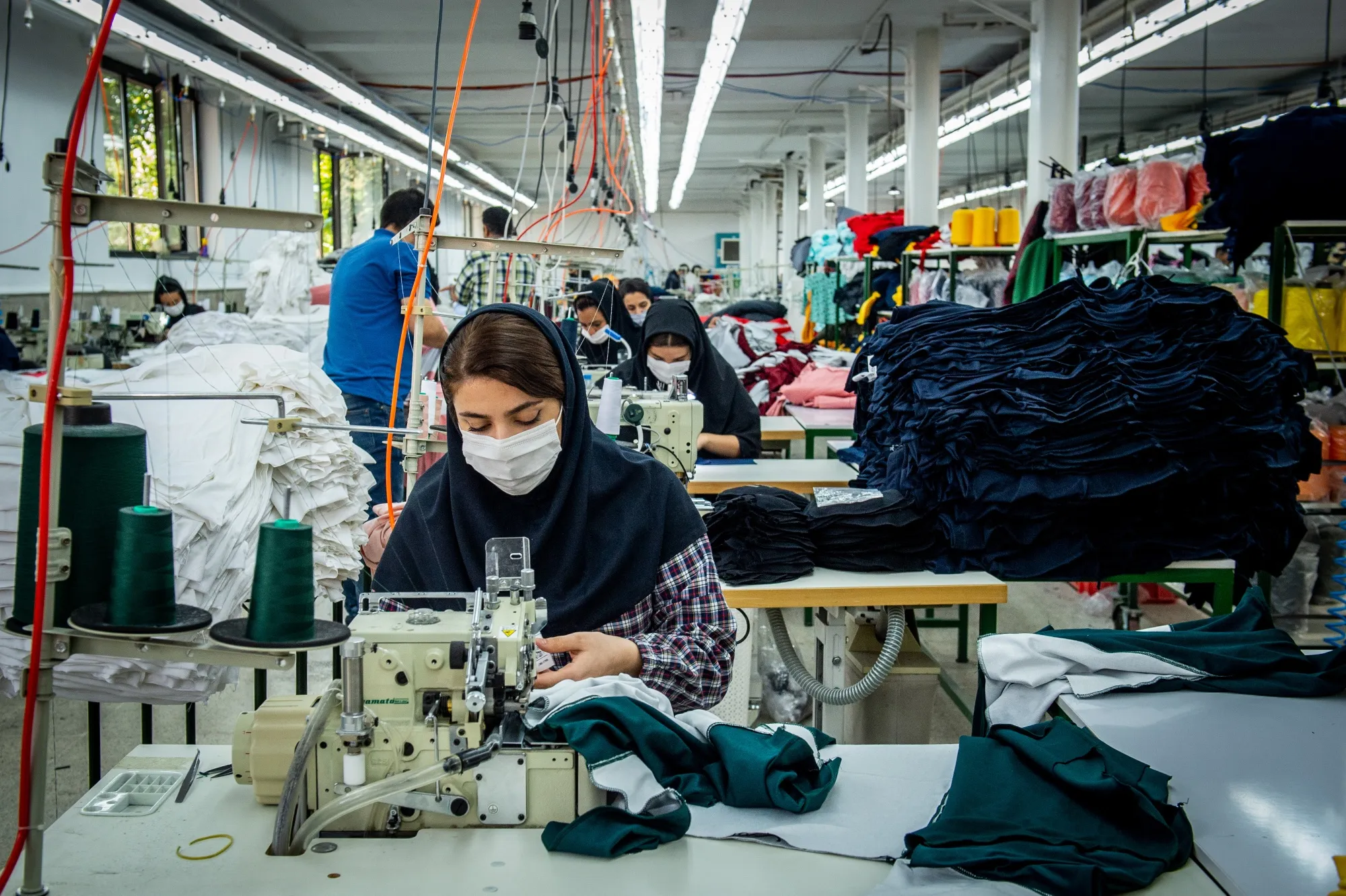 Workers at a factory on the outskirts of Tehran.
