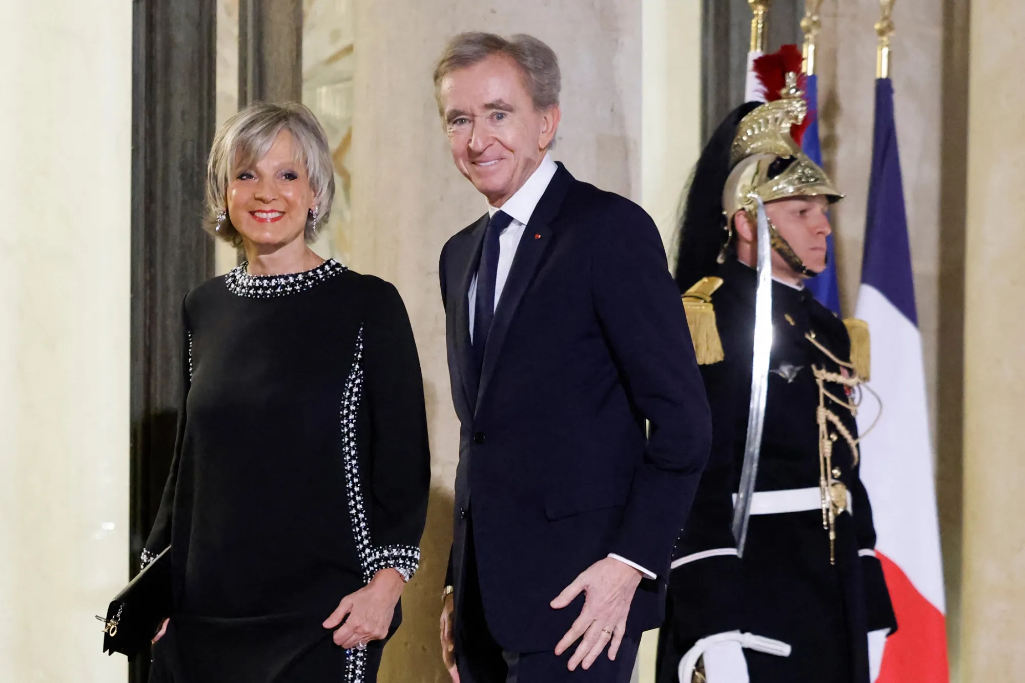 Bernard Arnault and his wife Helene arrive at the Elysee Palace in Paris in February.