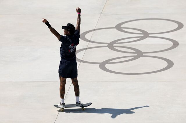 Nyjah Huston of Team United States waves to the crowd during the Men's Street Prelims on day three of the Olympic Games Paris 2024.