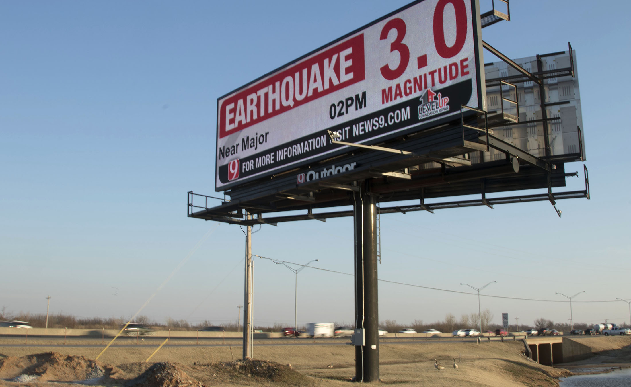 A road sign reports an earthquake in Edmond, Oklahoma, on Feb. 13.
