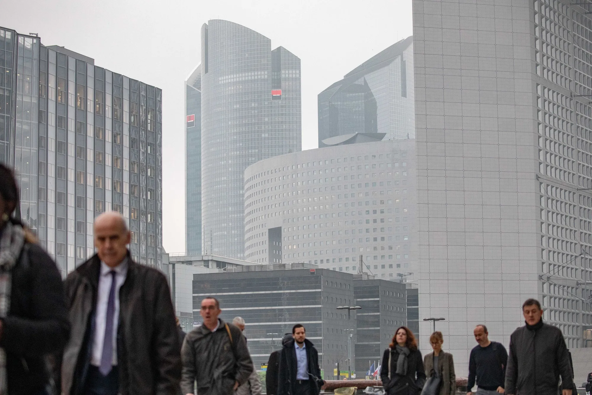 The Societe Generale SA headquarters, center, stand with other skyscrapers in the La Defense business district, Paris.&nbsp;
