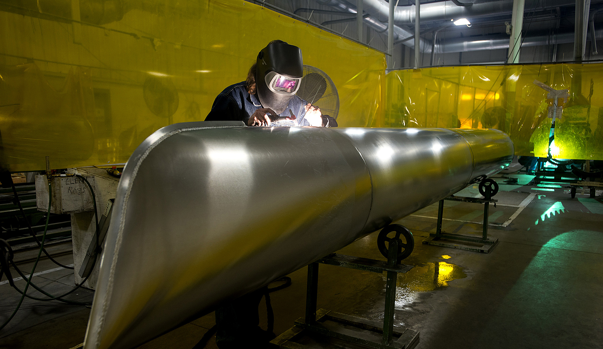 A worker welds an aluminum pontoon at a production facility in Elkhart, Indiana.