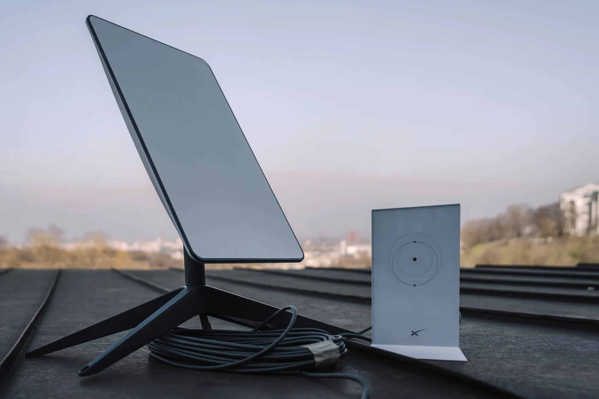 A Starlink satellite-internet communication system antenna and router.