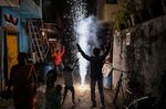 Revellers light firecrackers to celebrate Diwali&nbsp;in New Delhi, India.