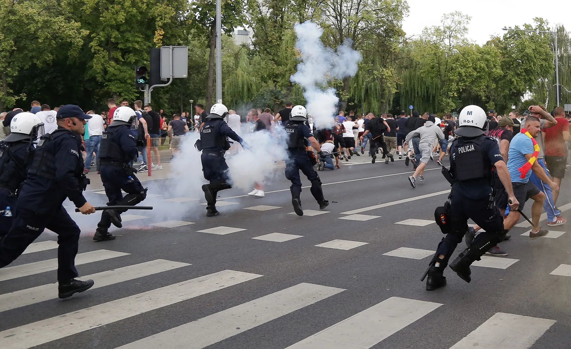 Riot police fire tear gas to disperse people&nbsp;after attacks during the parade,&nbsp;in Bialystok on July 20.&nbsp;
