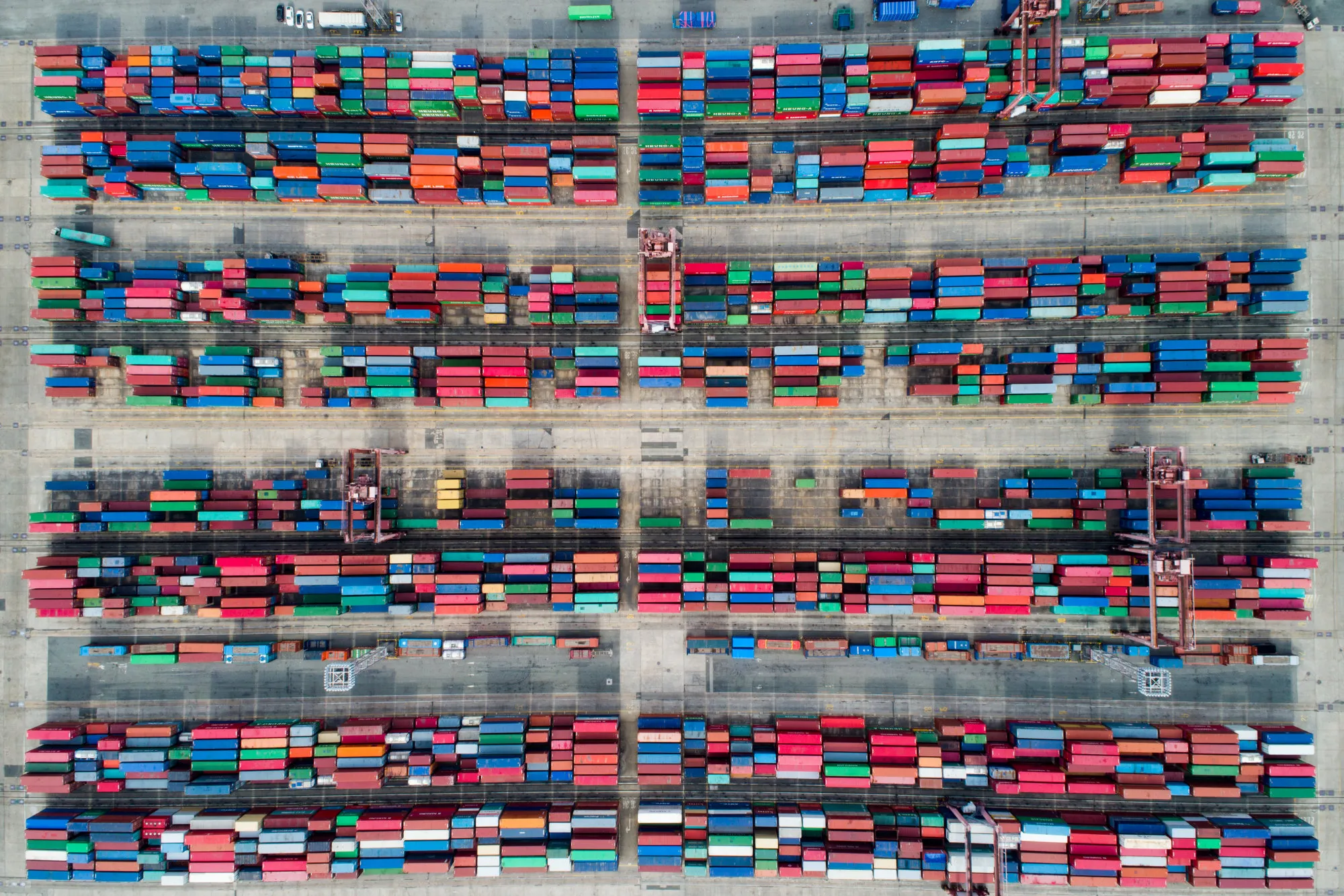Shipping containers sit stacked in this aerial photograph taken above the Busan Port Terminal (BPT) in Busan, South Korea.