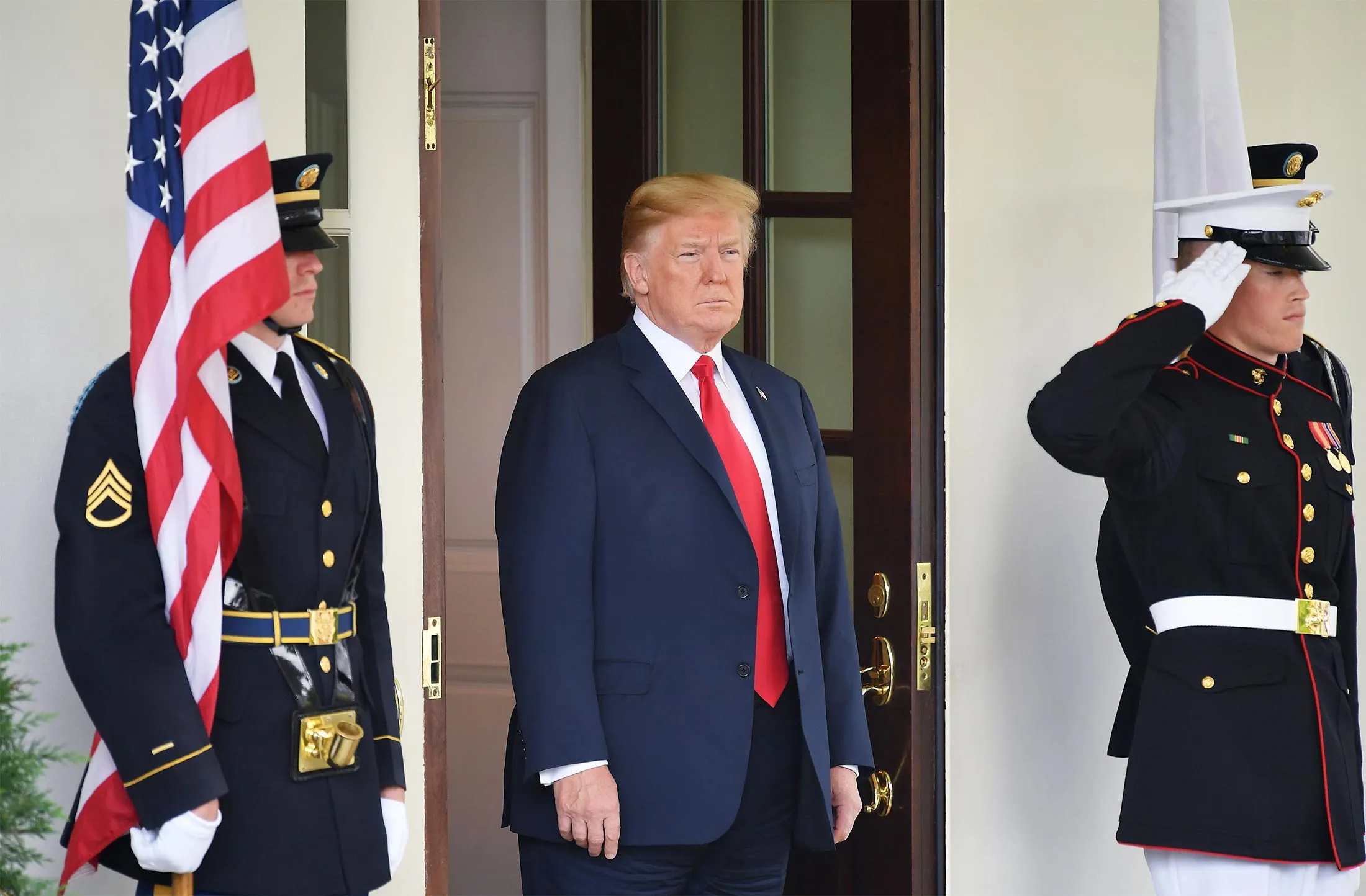 President Donald Trump greets Japan's Prime Minister Shinzo Abe upon his arrival at the White House on June 7.