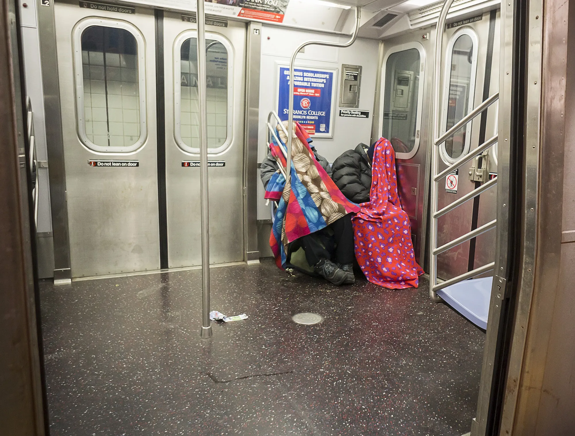Homeless individuals in the subway in New York.