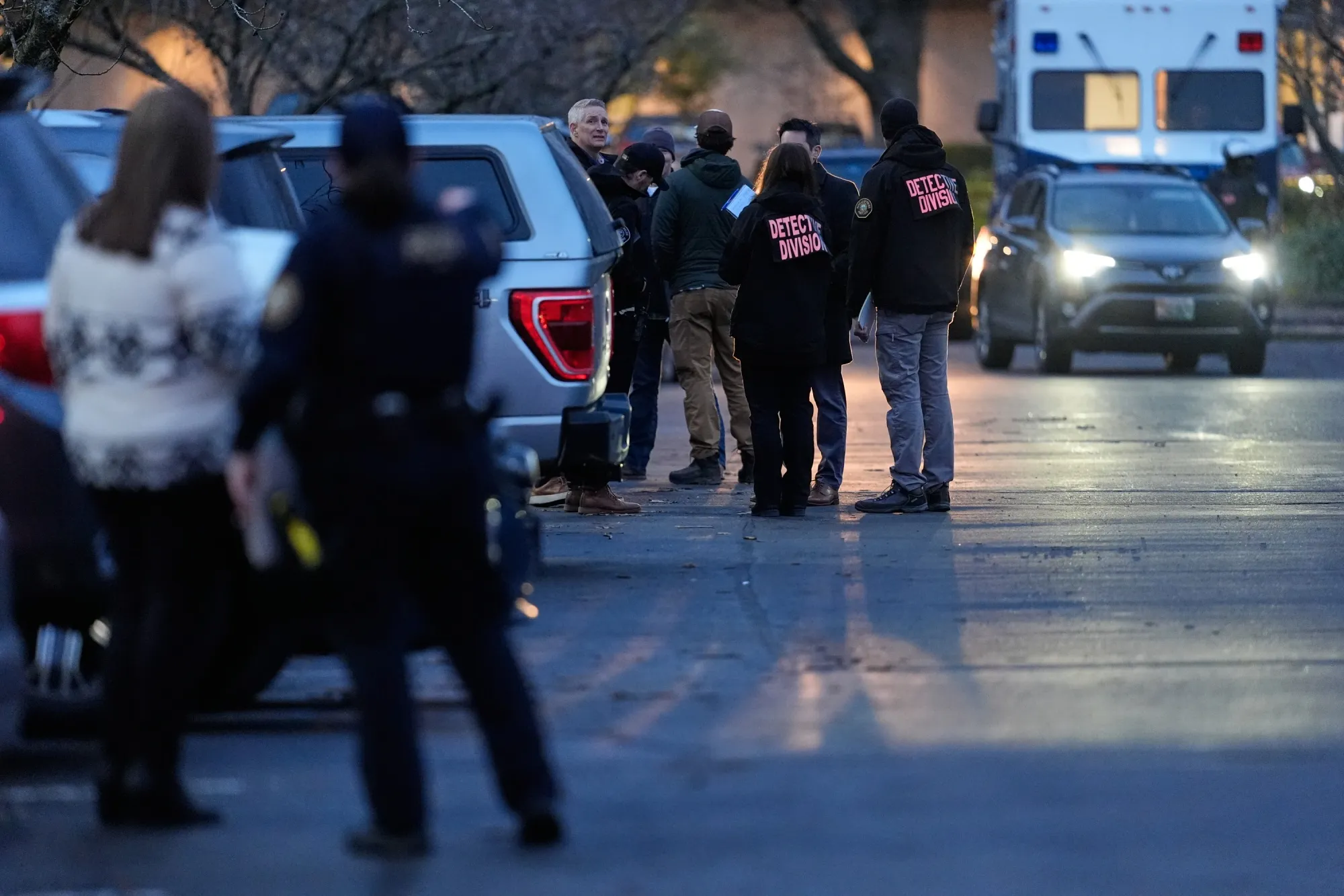 Law enforcement officials work the scene following reports that federal immigration officers shot and wounded people in Portland, Oregon on Jan. 8.