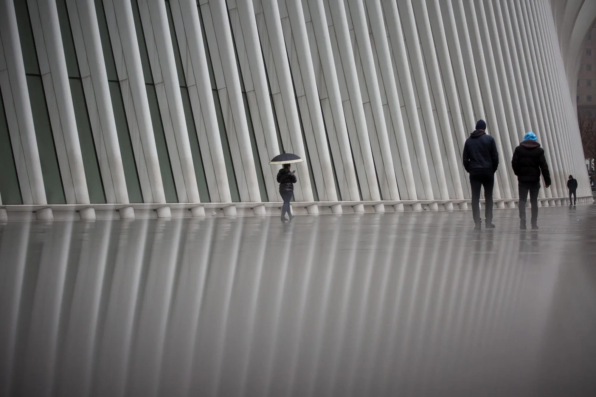 Pedestrians pass in front of the Oculus transportation hub in New York, on Feb. 26, 2020.