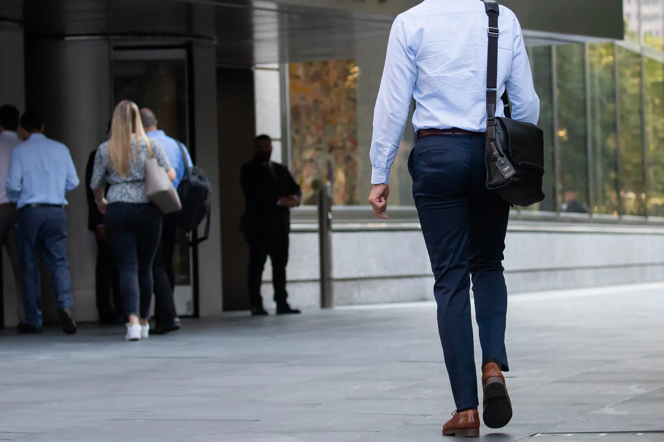 Workers walk into an office building&nbsp;in New York.