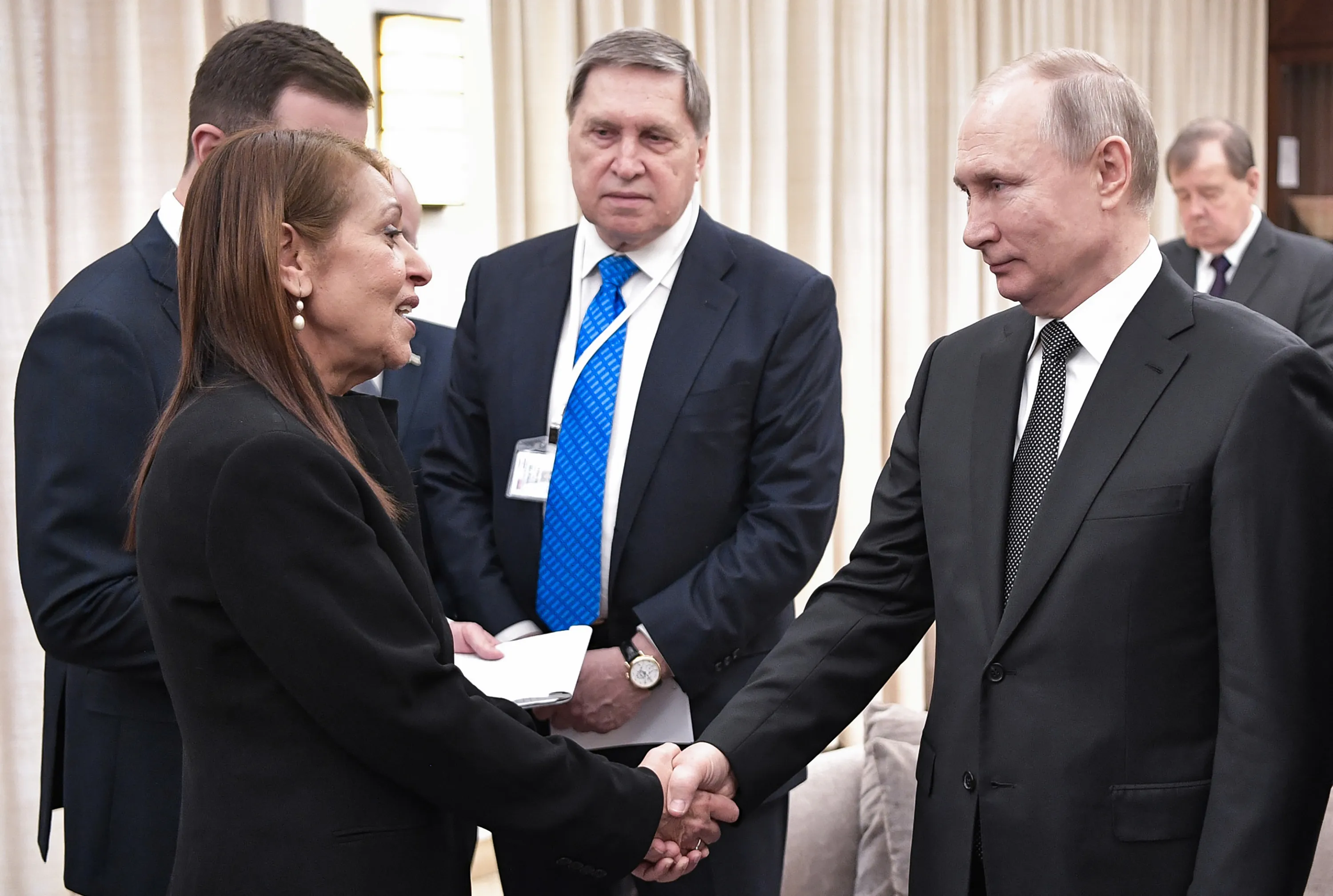 Vladimir Putin shakes hands with Yaffa Issachar during a meeting in Jerusalem on Jan. 23.