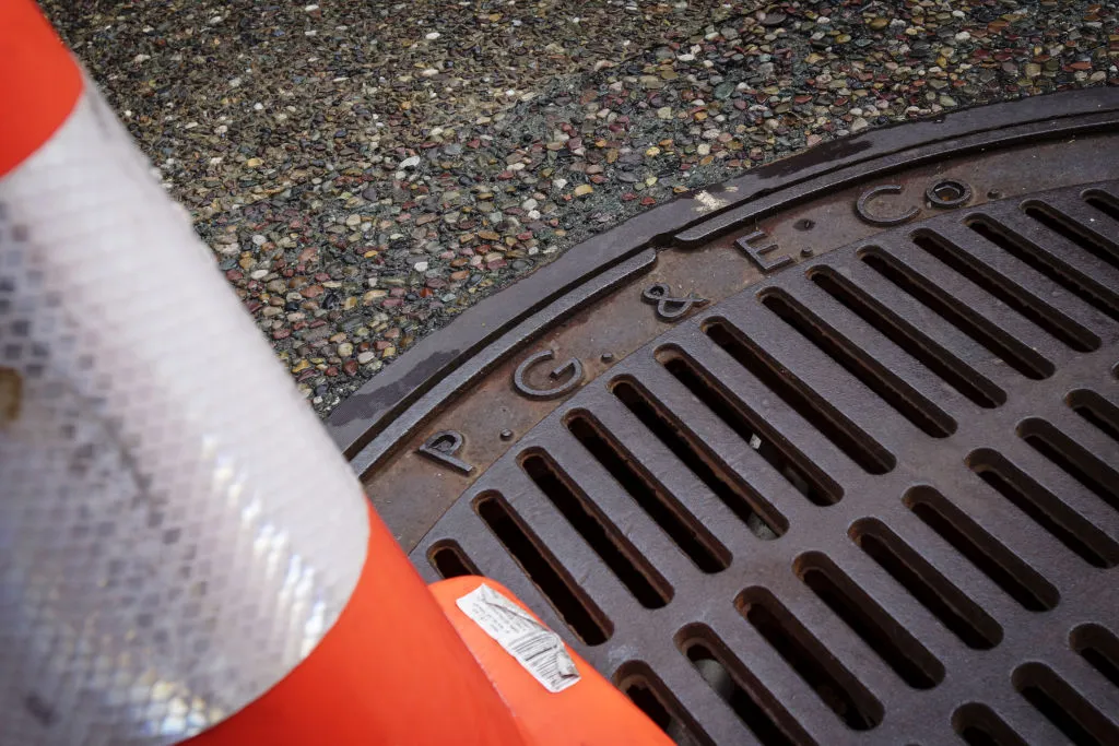 PG&amp;E lettering is seen on a manhole cover in front of Pacific Gas and Electric Corp. headquarters in San Francisco, California.