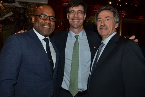 Colbert Narcisse of Morgna Stanley with Ken Rosh and Jonathan Mechanic of Fried Frank. Photographer: Amanda Gordon/Bloomberg