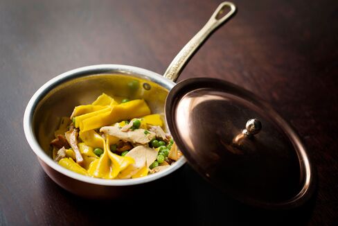 Farfalle is served with peas and girolles.