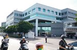 People enter the Hon Hai Precision Industry Co. headquarters in New Taipei City, Taiwan.