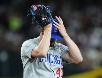 relates to Cubs reliever Luke Little forced to change his glove because of white in American flag patch