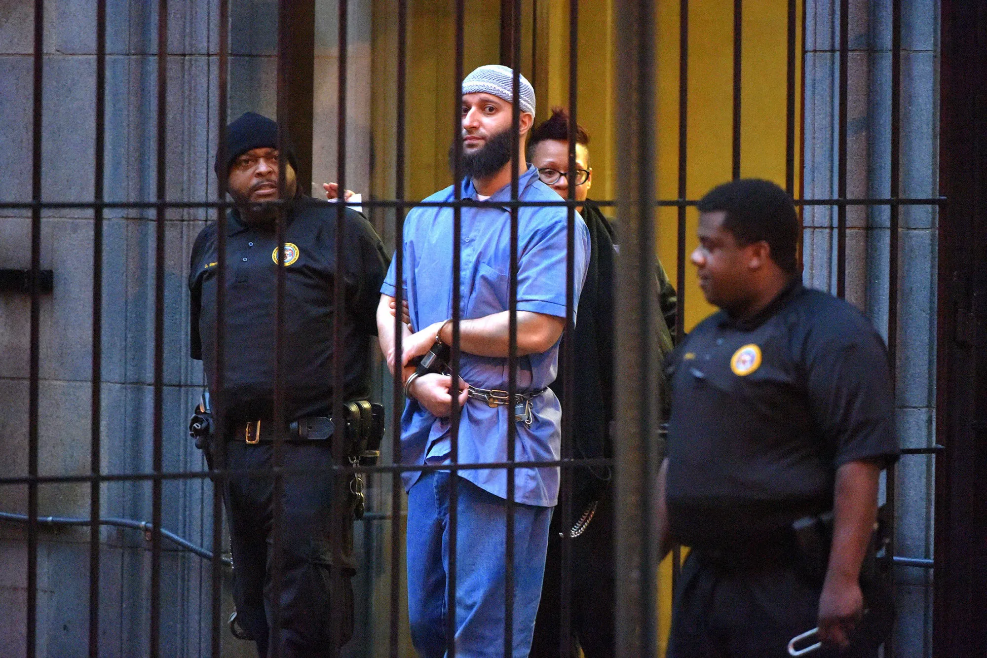 Officials escort Adnan Syed from the courthouse following the completion of the first day of hearings for a retrial in Baltimore on&nbsp;Feb. 3, 2016.