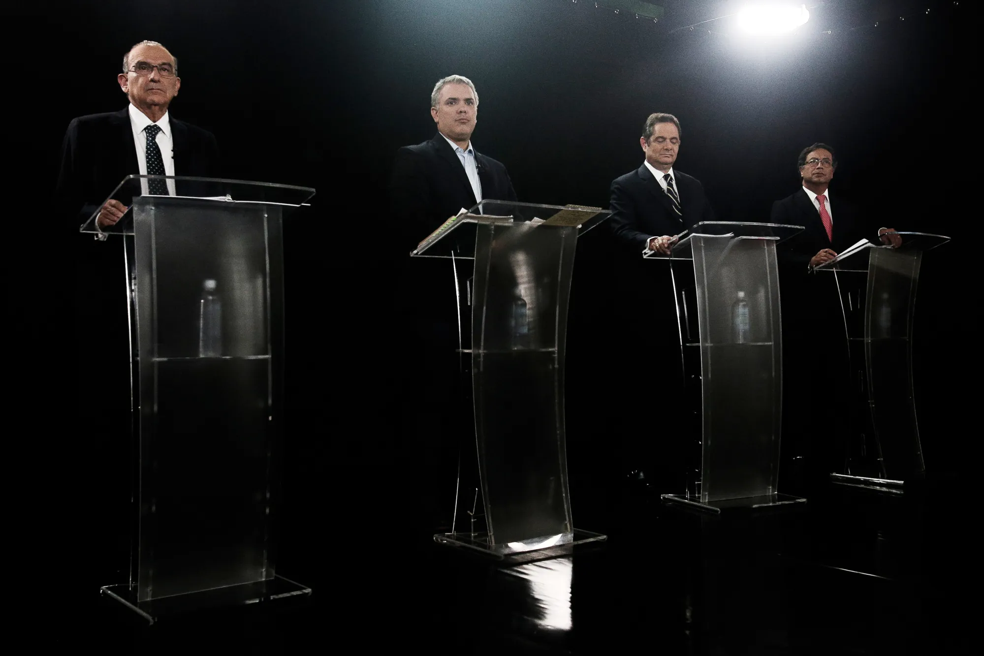 Humberto de la Calle, presidential candidate for the Colombian Liberal Party, from left, Ivan Duque, presidential candidate for the Democratic Center Party, German Vargas Lleras, former Colombian vice president and presidential candidate for the Radical Change party, and Gustavo Petro, presidential candidate for the Progressivists Movement Party, attend a televised presidential debate in Bogota, Colombia, on&nbsp;May 8, 2018.&nbsp;