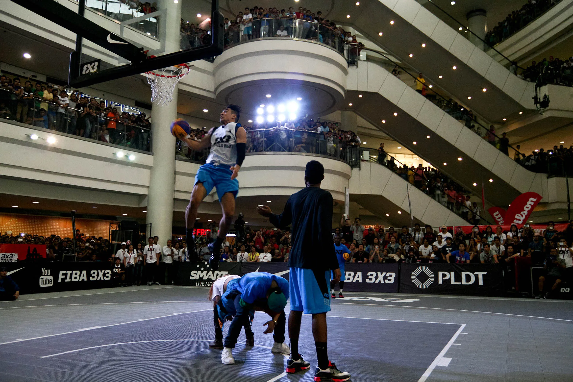 A basketball game is played at the Robinsons Mall in Manila.
