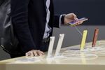 A customer looks at an Apple Inc. iPhone XR smartphone at a SoftBank Group Corp. store in Tokyo, Japan.